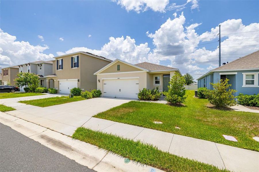 Front exterior of a new home in , Kissimmee, FL, highlighting curb appeal (Image 1). Front exterior of a new home in , Kissimmee, FL, highlighting curb appeal (Image 1).