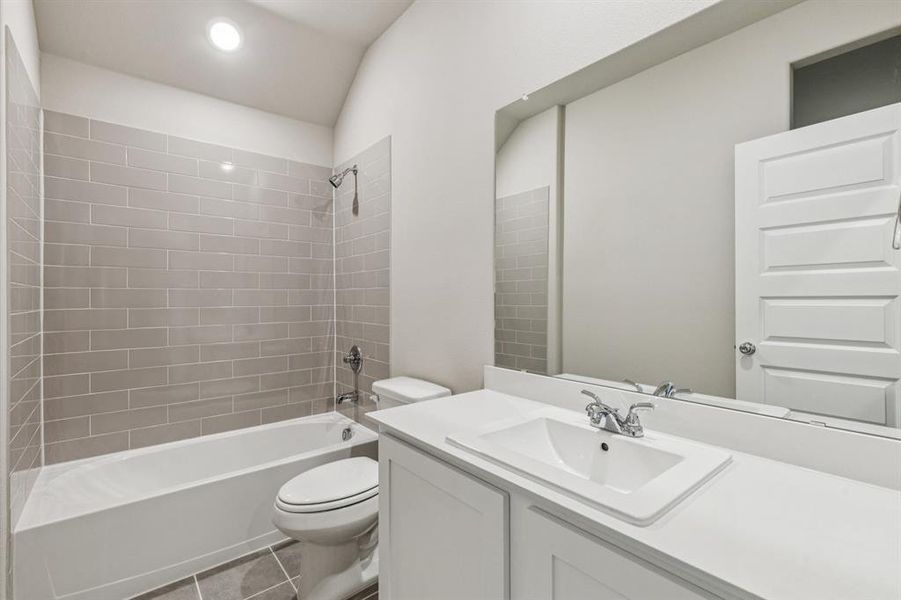 Bathroom in the Heisman home plan by Trophy Signature Homes – REPRESENTATIVE PHOTO Bathroom in the Heisman home plan by Trophy Signature Homes – REPRESENTATIVE PHOTO