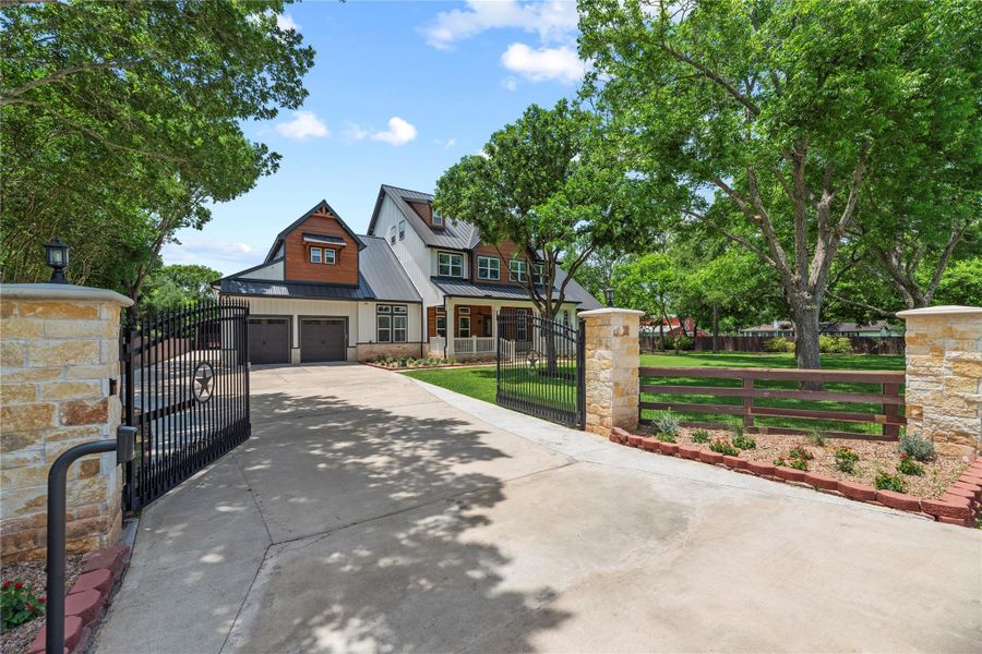 Behind automatic private gates, this extraordinary custom estate blends timeless architecture with elevated luxury on a sprawling homesite.