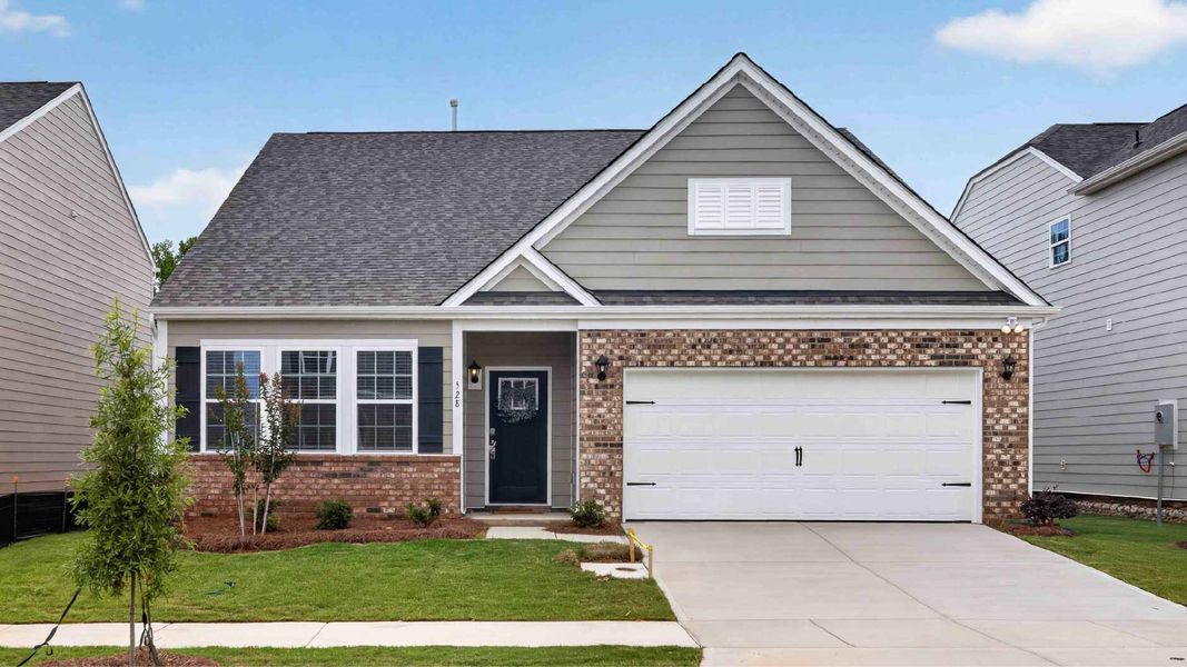 Front exterior of a new home in Twinleaf Meadows, Monroe, NC, highlighting curb appeal (Image 1). Front exterior of a new home in Twinleaf Meadows, Monroe, NC, highlighting curb appeal (Image 1).