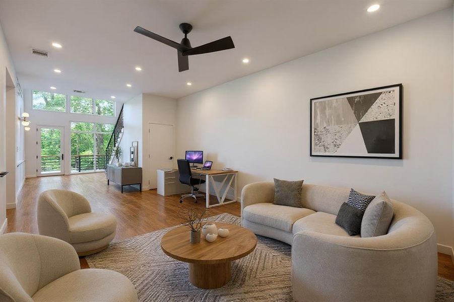 Living area with a desk, recessed lighting, wood finished floors, and a ceiling fan