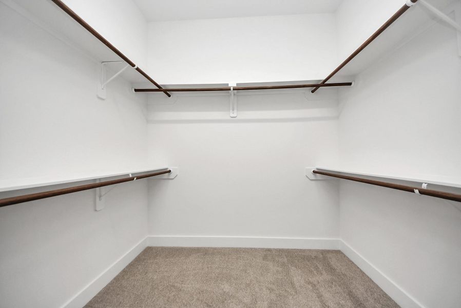 Additional view of primary closet.