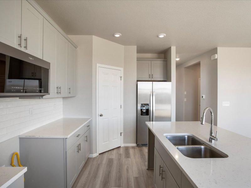 Furnished interior view inside a new home in Buffalo Highlands: The Flora Collection, Commerce City (Image 5).