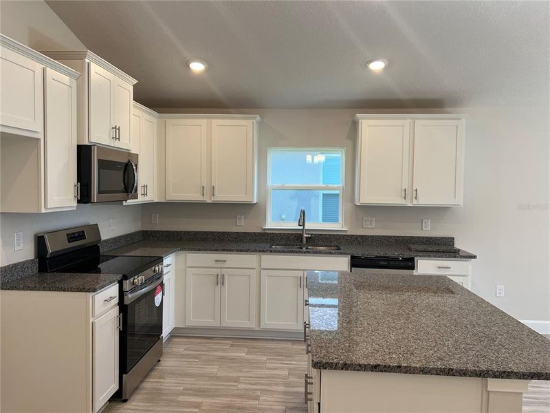 Furnished interior view inside a new home in Abbey Glen, Dade City (Image 6).