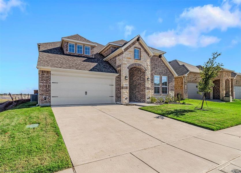 Front exterior of a new home in , Forney, TX, highlighting curb appeal (Image 1).