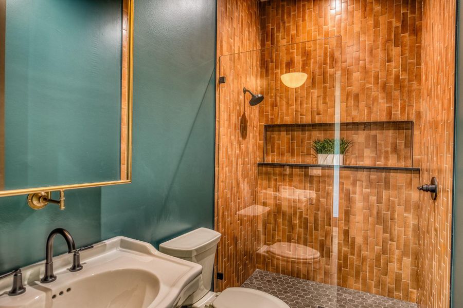 Bathroom with tiled shower Bathroom with tiled shower