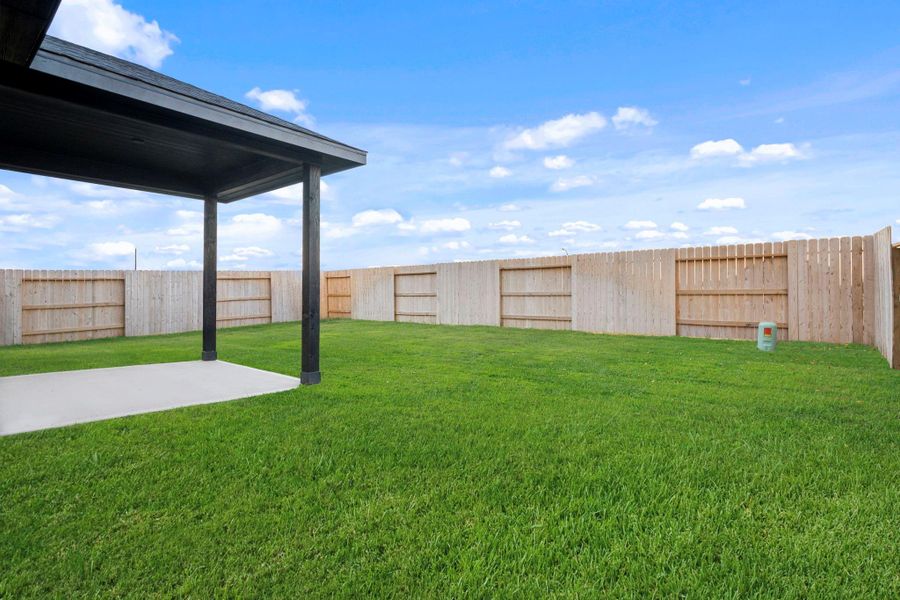 Step outside to a spacious backyard featuring a large, covered patio overlooking lush green grass. It’s the perfect setting for outdoor dining, weekend barbecues, or simply relaxing under the open sky.  Thar furry family pet will love this backyard!