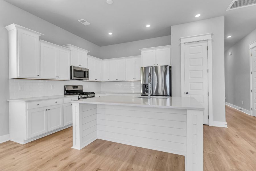 Furnished interior view inside a new home in Carnes Crossroads: Row Collection, Summerville (Image 6). Furnished interior view inside a new home in Carnes Crossroads: Row Collection, Summerville (Image 6).