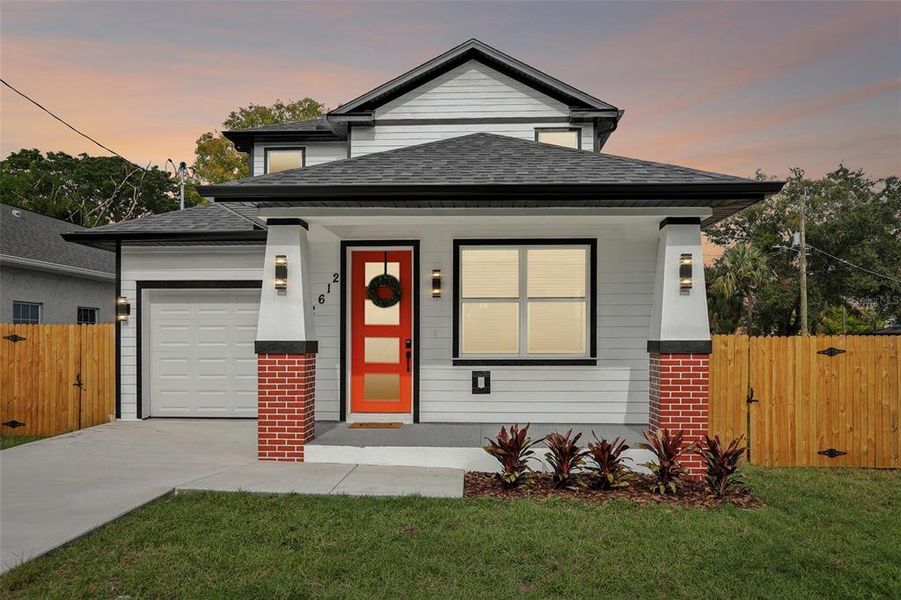Front exterior of a new home in , Tampa, FL, highlighting curb appeal (Image 26).