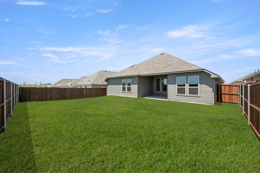 Front exterior of a new home in Still Water Lake Estates, Godley, TX, highlighting curb appeal (Image 26).