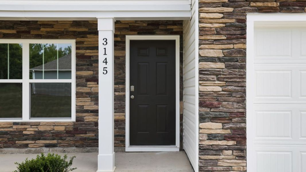 Exterior details and patio area of a home in Ravencrest, Roebuck (Image 3).