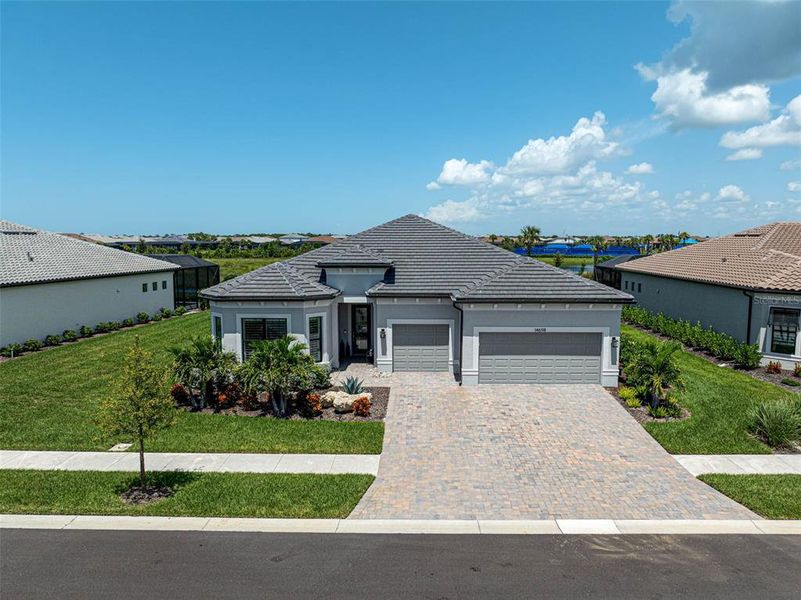 Front exterior of a new home in , Nokomis, FL, highlighting curb appeal (Image 26). Front exterior of a new home in , Nokomis, FL, highlighting curb appeal (Image 26).