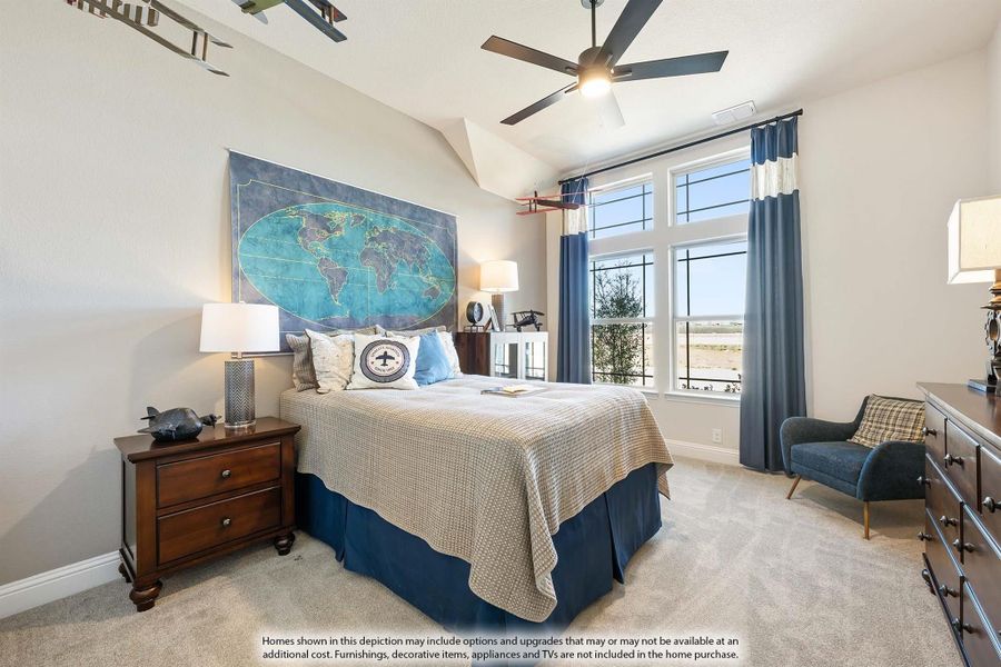 Bedroom with vaulted ceiling, ceiling fan, world map wall art, and large windows with blue curtains Bedroom with vaulted ceiling, ceiling fan, world map wall art, and large windows with blue curtains