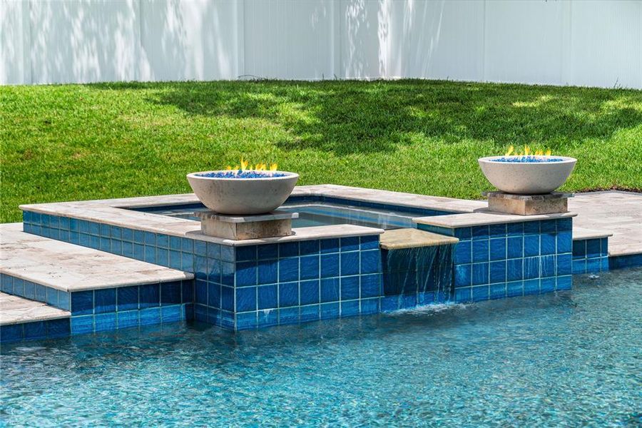 Heated pebbletec saltwater pool with spa, sunshelf with water feature, variable speed high efficiency pump, and 2 gas fireballs Heated pebbletec saltwater pool with spa, sunshelf with water feature, variable speed high efficiency pump, and 2 gas fireballs