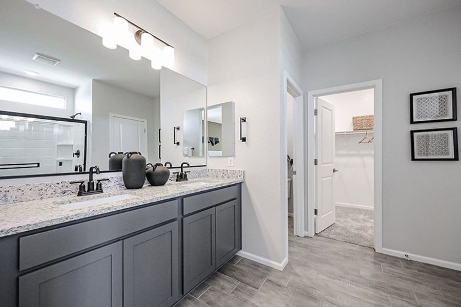 A bathroom with a marble countertop. A bathroom with a marble countertop.
