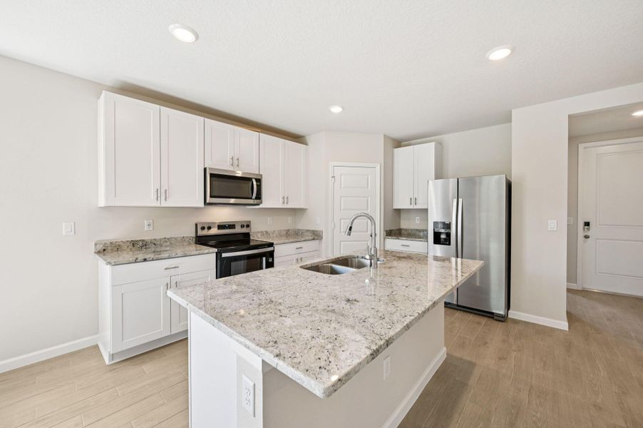Furnished interior view inside a new home in Hampton Park - Classic Series, Vero Beach (Image 5). Furnished interior view inside a new home in Hampton Park - Classic Series, Vero Beach (Image 5).