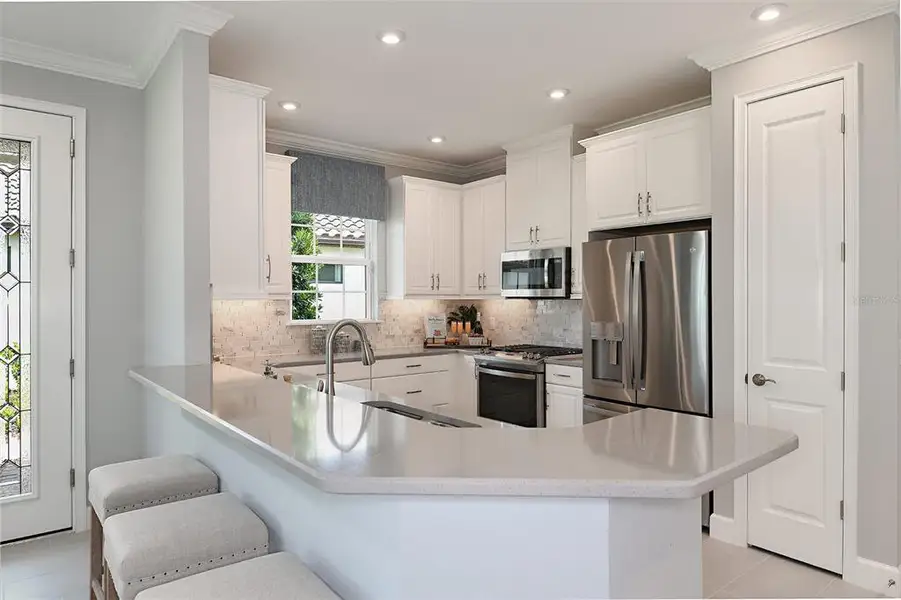 Furnished interior view inside a new home in Esplanade at Wellen Park, Englewood (Image 7).