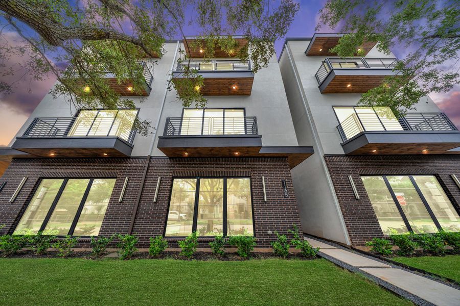 Welcome to Lake Pointe! This modern four home features a contemporary design with sleek balconies, large windows, and a combination of brick and stucco exterior. Welcome to Lake Pointe! This modern four home features a contemporary design with sleek balconies, large windows, and a combination of brick and stucco exterior.