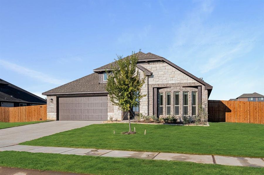 Front exterior of a new home in Coyote Crossing, Godley, TX, highlighting curb appeal (Image 25).
