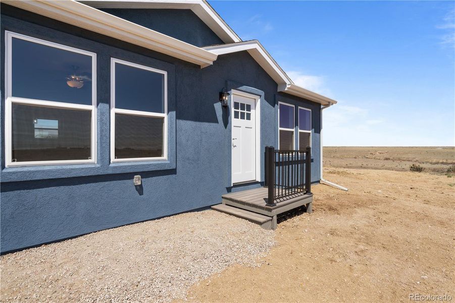 Front exterior of a new home in , Fountain, CO, highlighting curb appeal (Image 22).