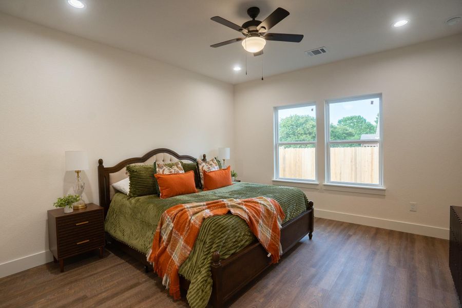 Bedroom with baseboards, dark wood-style flooring, recessed lighting, and ceiling fan