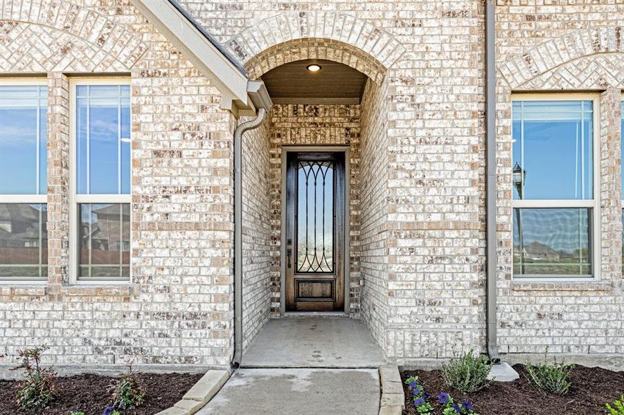 Front exterior of a new home in Sunset Ridge, Alvarado, TX, highlighting curb appeal (Image 2). Front exterior of a new home in Sunset Ridge, Alvarado, TX, highlighting curb appeal (Image 2).