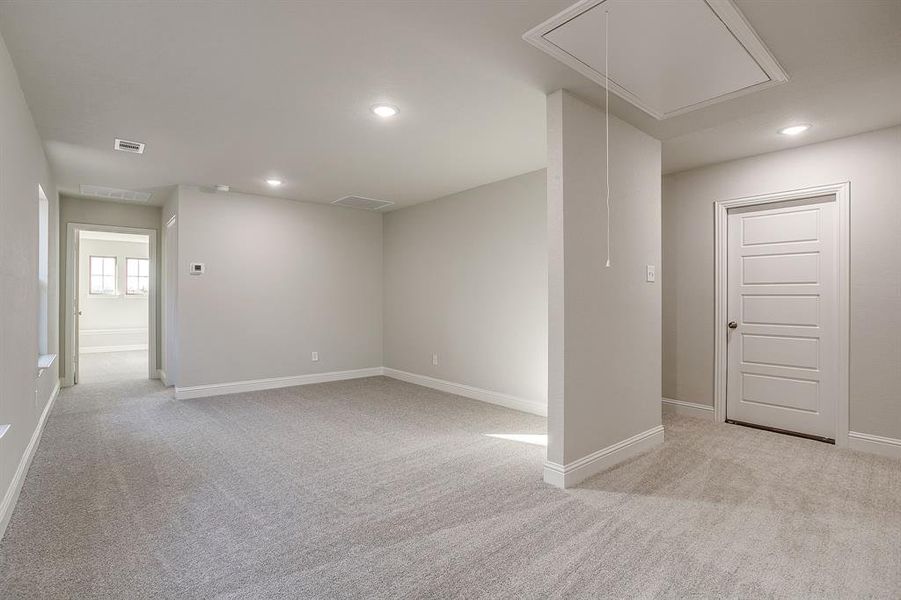 Unfurnished room featuring light carpet and recessed lighting Unfurnished room featuring light carpet and recessed lighting