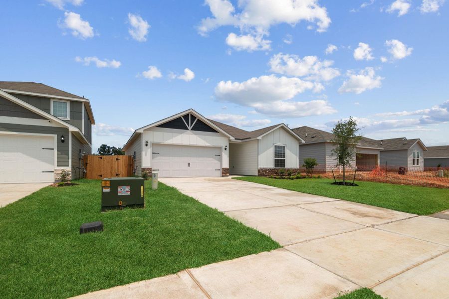 Front exterior of a new home in Trails at Cochran Ranch, Waller, TX, highlighting curb appeal (Image 16). Front exterior of a new home in Trails at Cochran Ranch, Waller, TX, highlighting curb appeal (Image 16).