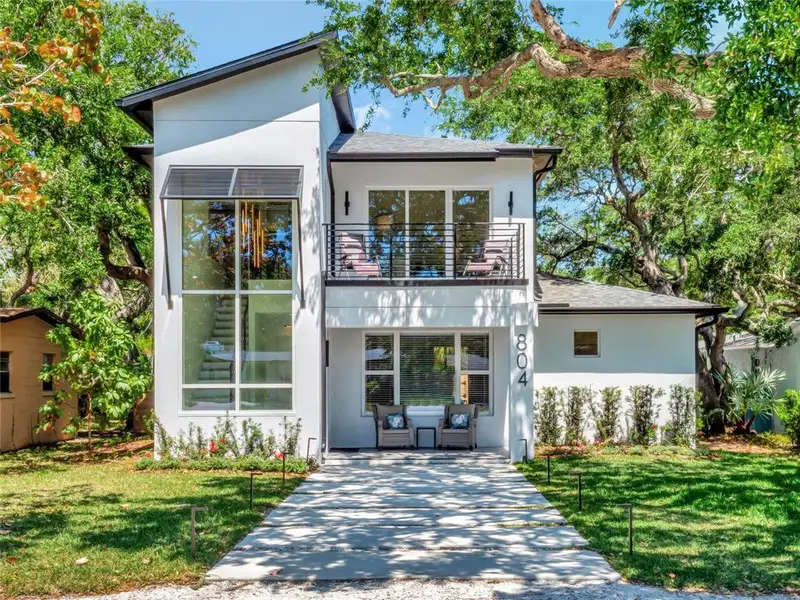 Front exterior of a new home in , New Smyrna Beach, FL, highlighting curb appeal (Image 1).