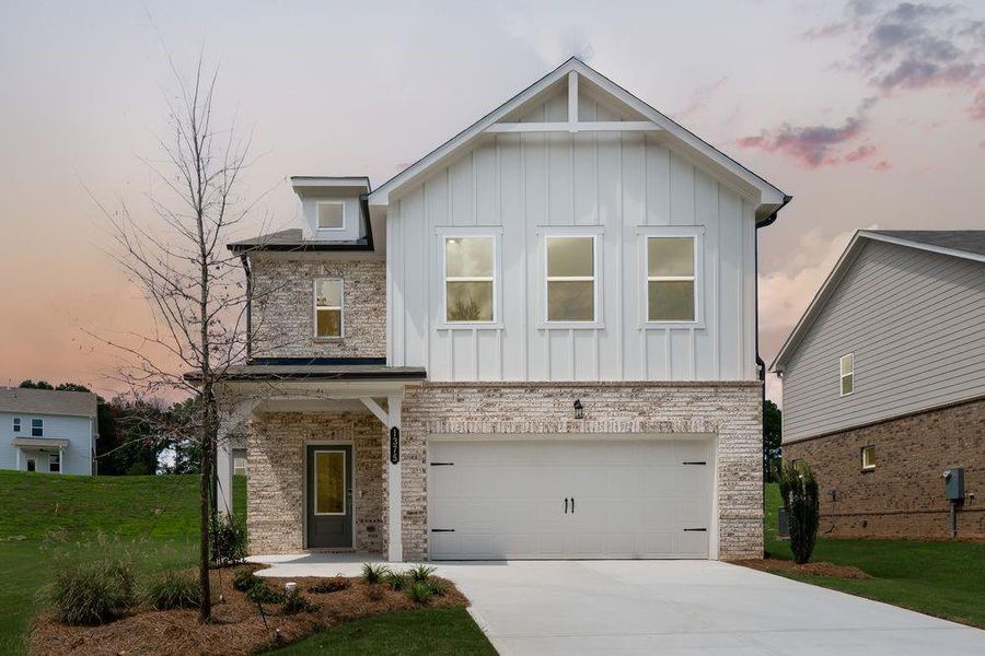 Front exterior of a new home in Windance Lake, Loganville, GA, highlighting curb appeal (Image 2). Front exterior of a new home in Windance Lake, Loganville, GA, highlighting curb appeal (Image 2).