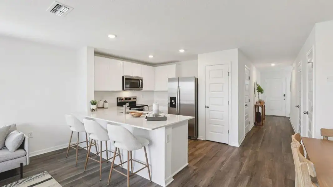 Furnished interior view inside a new home in Atria at Ridgewood Lakes, Davenport (Image 4).