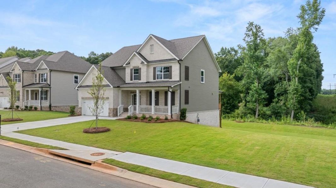 Front exterior of a new home in Haven Abbey, Cumming, GA, highlighting curb appeal (Image 2).