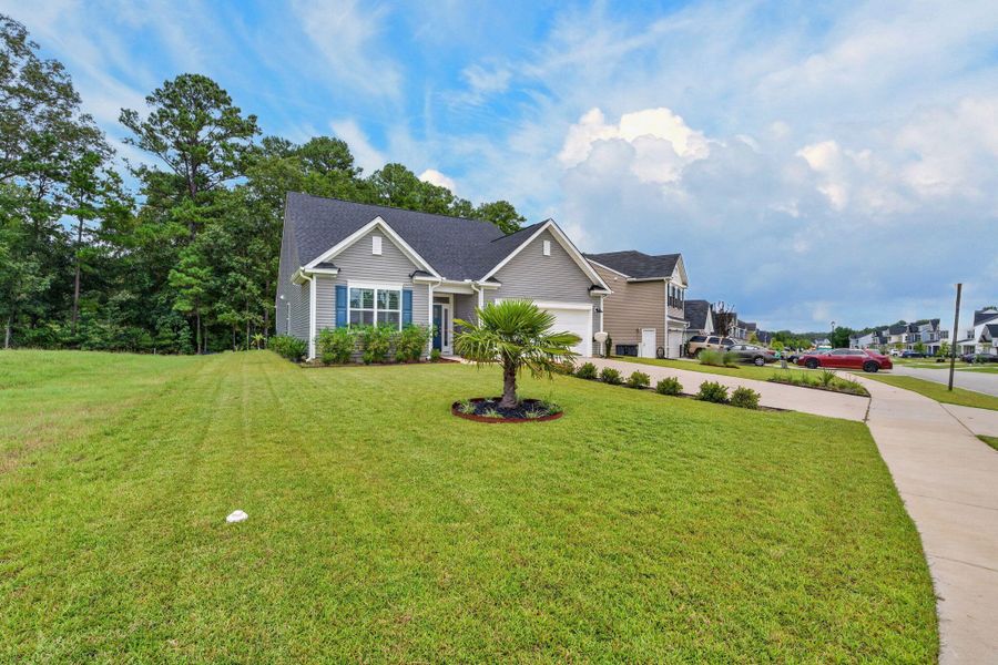Front exterior of a new home in , Ridgeville, SC, highlighting curb appeal (Image 27).