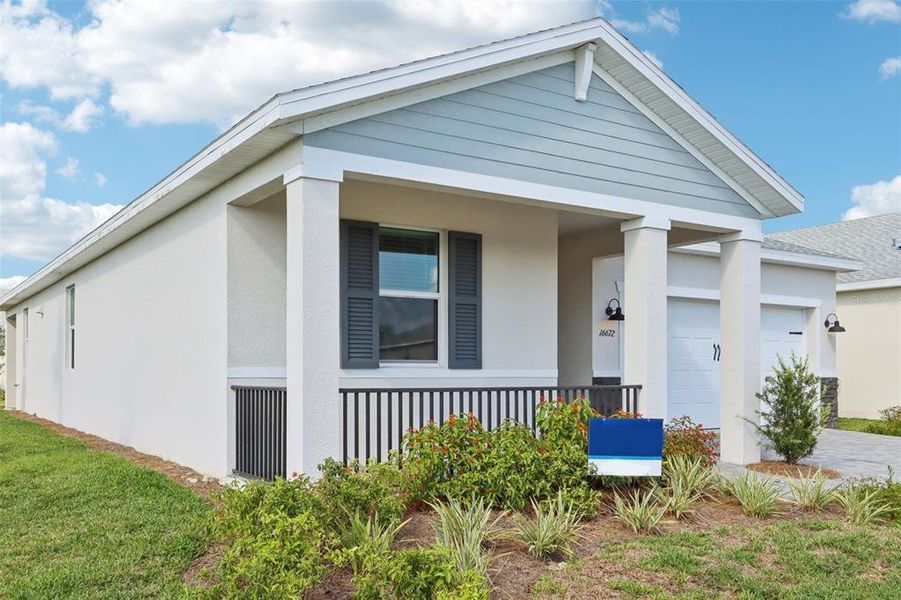 Exterior details and patio area of a home in Crescent Lakes - Reserve Series, Punta Gorda (Image 1). Exterior details and patio area of a home in Crescent Lakes - Reserve Series, Punta Gorda (Image 1).
