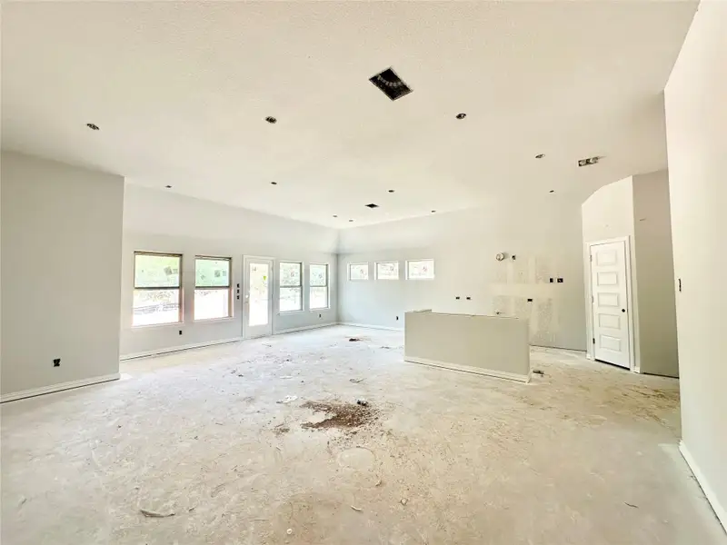 Unfurnished room featuring baseboards and a textured ceiling Unfurnished room featuring baseboards and a textured ceiling