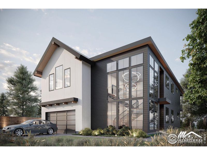 Front of home with garage and soaring windows