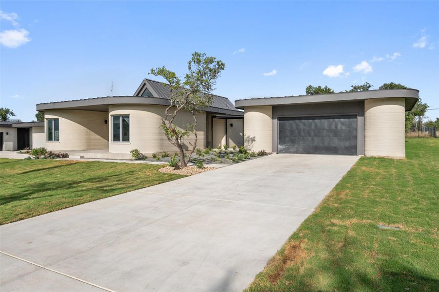Front exterior of a new home in Wimberley Springs, Wimberley, TX, highlighting curb appeal (Image 2). Front exterior of a new home in Wimberley Springs, Wimberley, TX, highlighting curb appeal (Image 2).