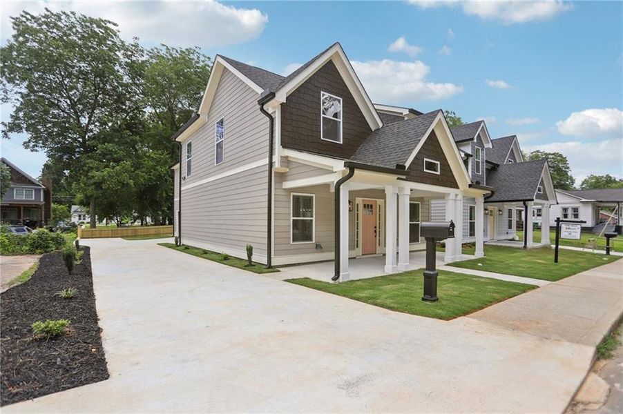 Front exterior of a new home in , Hapeville, GA, highlighting curb appeal (Image 27).