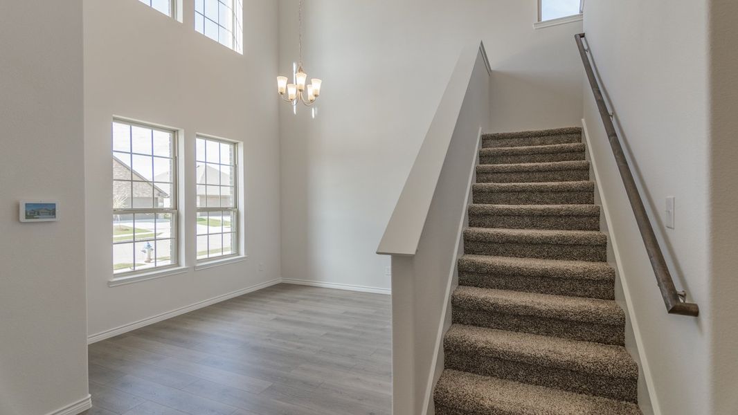 Representative unfurnished interior of a home built from the Medbourne by D.R. Horton in Woodcreek, Fate (Image 7).