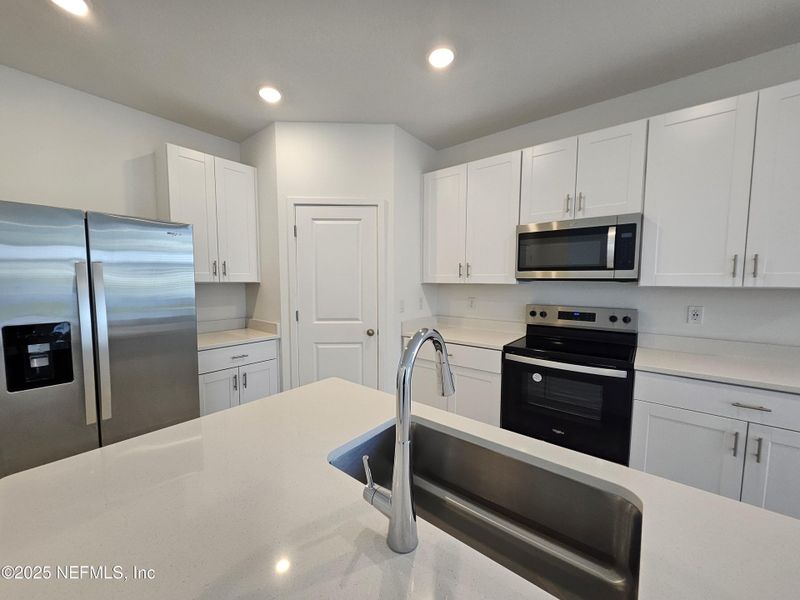 Furnished interior view inside a new home in Lakes at Bella Lago - Signature Series, Green Cove Springs (Image 3).