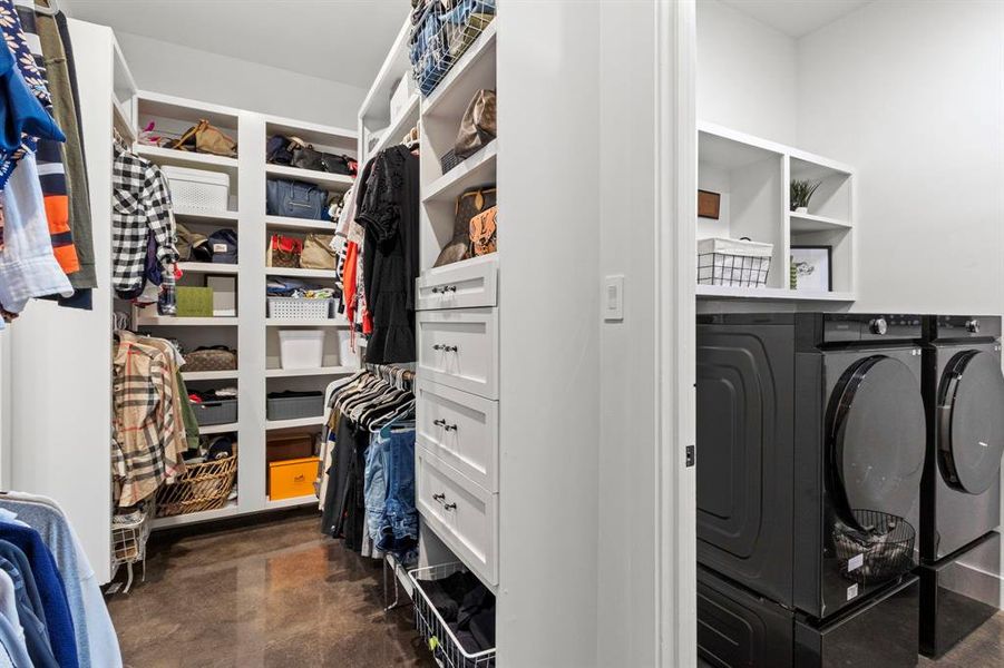 Sneak peak of ONE of the primary closets with access to the utility room.