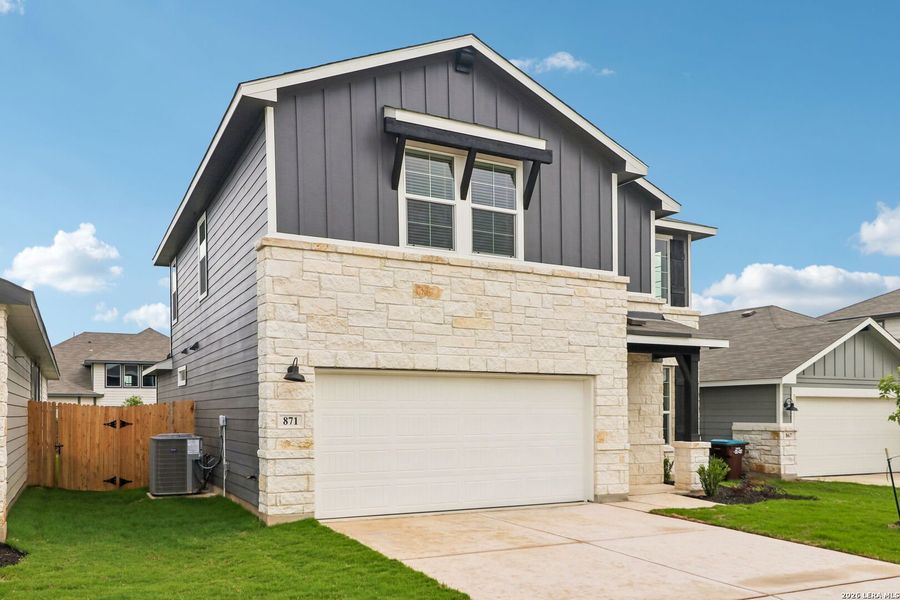 Front exterior of a new home in Estancia Ranch - Premier Series, San Antonio, TX, highlighting curb appeal (Image 23). Front exterior of a new home in Estancia Ranch - Premier Series, San Antonio, TX, highlighting curb appeal (Image 23).
