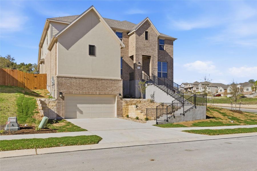 Front exterior of a new home in Retreat at San Gabriel, Georgetown, TX, highlighting curb appeal (Image 22).