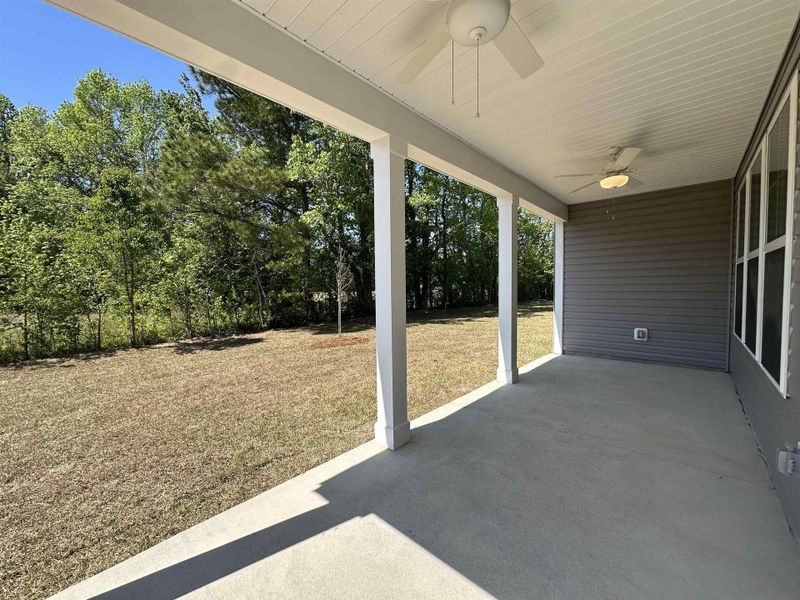Exterior details and patio area of a home in Oak Hollow, Longs (Image 13).
