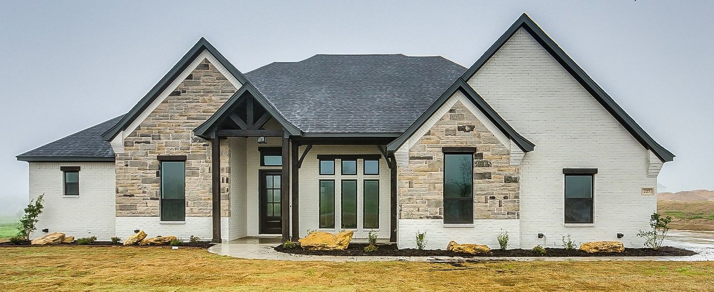 Representative exterior photo of a completed home built from the 124-2549-0719 by Abba River Homes in Stanford Estates, Springtown, TX (Image 1). Representative exterior photo of a completed home built from the 124-2549-0719 by Abba River Homes in Stanford Estates, Springtown, TX (Image 1).