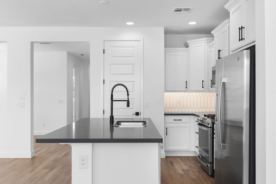 Furnished interior view inside a new home in CantaMia at Estrella 55+, Goodyear (Image 17).
