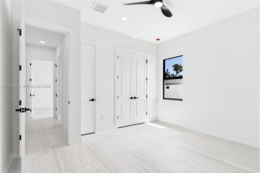 A COMFORTABLE THIRD BEDROOM offers a bright, peaceful retreat for FAMILY or GUESTS w/ modern finishes & generous closet space. A COMFORTABLE THIRD BEDROOM offers a bright, peaceful retreat for FAMILY or GUESTS w/ modern finishes & generous closet space.