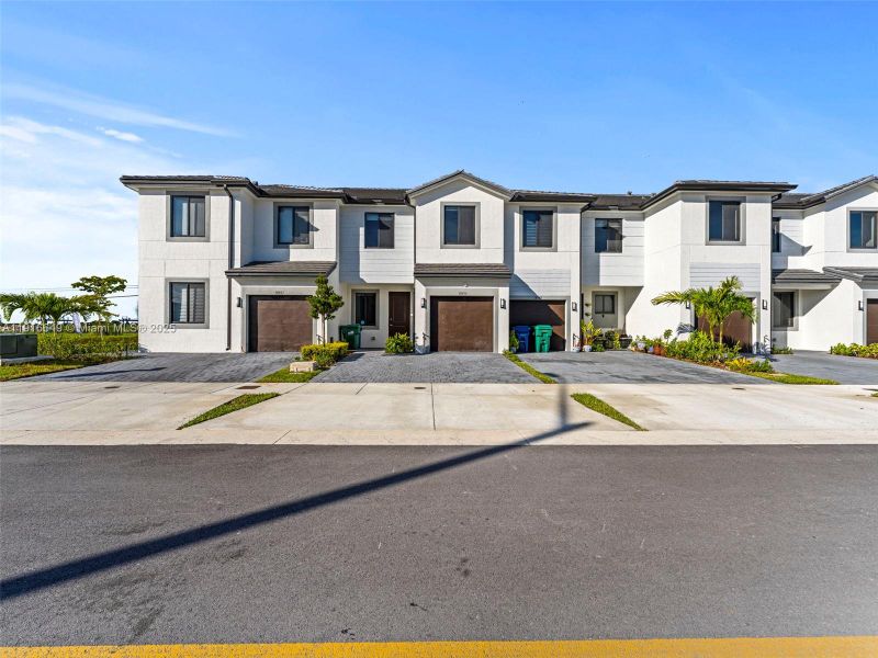 Front exterior of a new home in , Homestead, FL, highlighting curb appeal (Image 20). Front exterior of a new home in , Homestead, FL, highlighting curb appeal (Image 20).