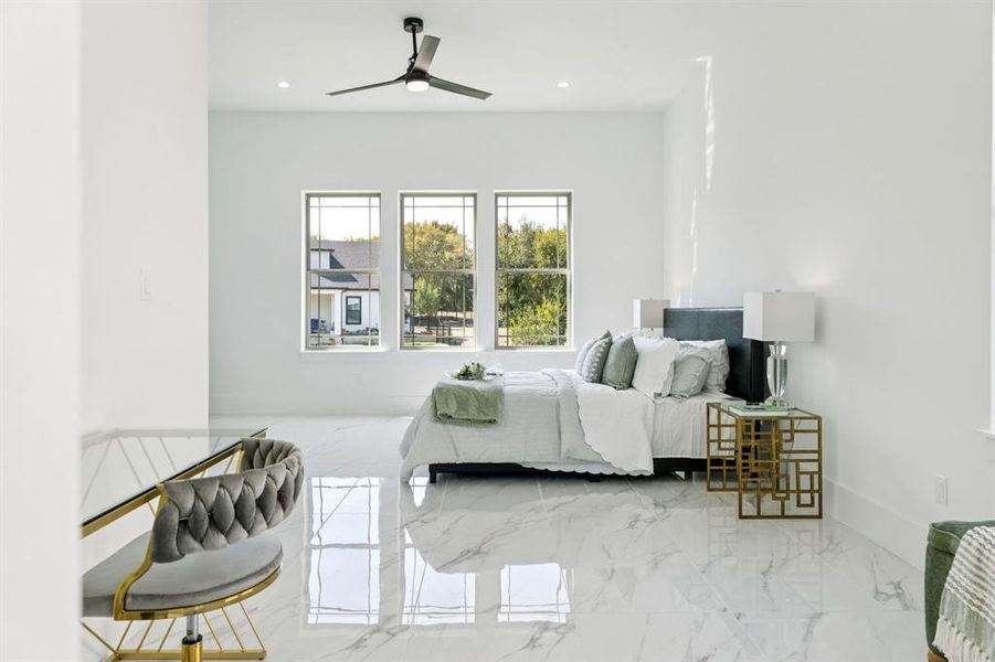 Bedroom with marble tiled flooring, ceiling fan, and recessed lighting Bedroom with marble tiled flooring, ceiling fan, and recessed lighting