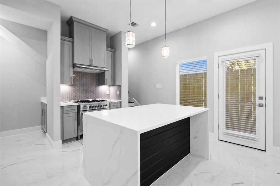 From the living room, you love how the open layout keeps the kitchen and dining area within view, making conversations flow effortlessly while you cook or entertain.